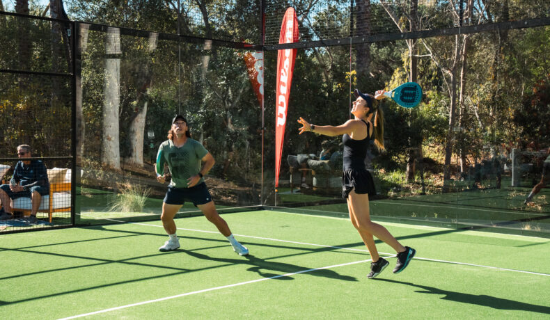Members playing padel on a glass court at Rancho Valencia